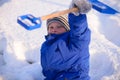 Child in winter clothes outside the city on the background of a Royalty Free Stock Photo
