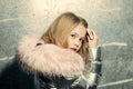 Child in winter coat with fur hood, fashion. Child fashion, trend and style concept