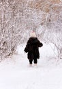 Child On Winter Forest