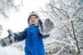 child in winter, happy face, playing and smiling