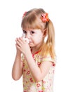 Child wiping or cleaning nose with tissue isolated on white