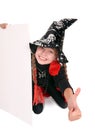 Child witch holding banner