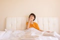 The child woke up and sits on the bed, boy yawns Royalty Free Stock Photo