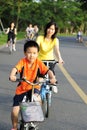 A child and a women cycling