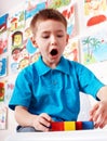 Child with wood block in play room. Royalty Free Stock Photo