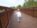 Child on wooden walkway Royalty Free Stock Photo