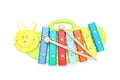 Child wooden xylophone andwooden sticks on a white background. E