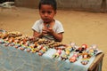 Child-work: Portrait of a young boy selling souveniers