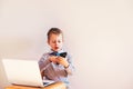 Child working with his computer in his business, concentrated typing to succeed, funny image Royalty Free Stock Photo