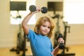 Child workout kid in gym. Kid sport. Child exercising with dumbbells. Sporty child with dumbbell. Royalty Free Stock Photo