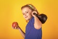 Child workout. Kid sport. Child exercising with kettlebell dumbbells. Sporty child with dumbbell. Royalty Free Stock Photo