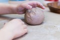 The child works with clay. The concept of a creative workshop for a child. Royalty Free Stock Photo