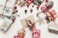 Child writes letter to Santa Claus top view. kid hands holding p Royalty Free Stock Photo