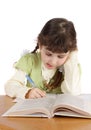 Child writes and reads,isolated. Royalty Free Stock Photo