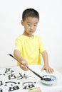 A child writing Chinese Calligraphy Royalty Free Stock Photo
