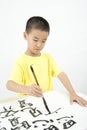 A child writing Chinese Calligraphy