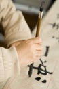 A child writing Chinese Calligraphy Royalty Free Stock Photo