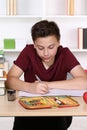 Child writing homework at school Royalty Free Stock Photo