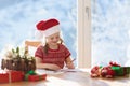Child writing letter to Santa. Present wish list Royalty Free Stock Photo