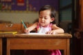 Child writing and smile