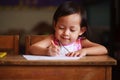 Child writing and smile