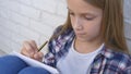 Child Writing, Studying, Thoughtful Kid, Pensive Student Learning Schoolgirl Royalty Free Stock Photo