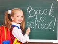 Child writting on blackboard. Royalty Free Stock Photo