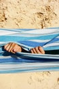 Child& x27;s hand holding fabric resting in the hammock Royalty Free Stock Photo