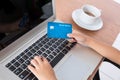 Child& x27;s hands holding credit card and typing on keyboard Royalty Free Stock Photo