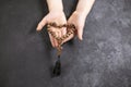 Child& x27;s hands holding the wooden cross and beads th in the shape of a heart. Royalty Free Stock Photo