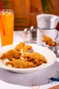 Child's meal of chicken tenders, french fries, and ketchup, with colorful crayons on the table Royalty Free Stock Photo