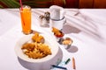 Child's meal of chicken tenders, french fries, and ketchup, with colorful crayons on the table Royalty Free Stock Photo