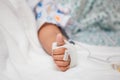 Child& x27;s patient hand with saline intravenous & x28;iv& x29; drip Royalty Free Stock Photo