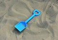 Childs spade / shovel on a sandy beach