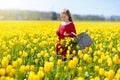 Child in yellow tulip flower field in Holland Royalty Free Stock Photo