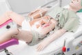 Childbirth new born baby from mom`s abdomen with medical dummy