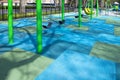 Childern`s colorful swing playground in urban city setting