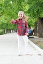 Childhood activities that will never grow old. Happy little child wearing casual plaid design for playing outdoor