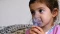 Childhood asthma inhaling mask illnesses little baby girl with flu id doing aerosol independently