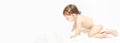 Little baby boy or girl crawling on floor at home Royalty Free Stock Photo