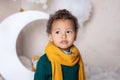 Childhood. Black boy close up. Portrait of a cheerful smiling boy in a yellow scarf. Portrait of a little African American. Baby s Royalty Free Stock Photo