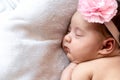 Childhood, care, motherhood, health, medicine, pediatrics concepts - Close up Little peace calm infant newborn baby girl in Royalty Free Stock Photo