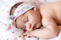 Childhood, care, motherhood, health, medicine, pediatrics concepts - Close up Little peace calm infant newborn baby girl in Royalty Free Stock Photo
