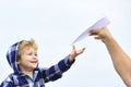 Childhood. Child son playing with paper airplane. Carefree. Freedom to Dream - Joyful Boy Playing With Paper Airplane. Royalty Free Stock Photo