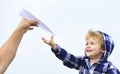 Childhood. Child son playing with paper airplane. Carefree. Freedom to Dream - Joyful Boy Playing With Paper Airplane. Royalty Free Stock Photo