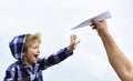 Childhood. Child son playing with paper airplane. Carefree. Freedom to Dream - Joyful Boy Playing With Paper Airplane Royalty Free Stock Photo