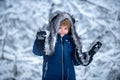 Childhood on countryside. Cute Winter boy in frosty winter Park. Happy winter time. The morning before Christmas. Royalty Free Stock Photo