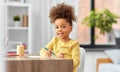 little girl with felt pen drawing picture at home Royalty Free Stock Photo