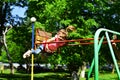 Childhood daydream .teen freedom. Small kid playing in summer. Playground in park. Happy laughing child girl on swing Royalty Free Stock Photo