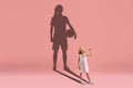 Childhood and dream about big and famous future. Conceptual image with girl and shadow of fit basketball or soccer